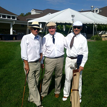 Three players of the Metropolitan Hickory Society prepare for a great day of golf.