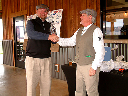 Andrew von Lossow receives the Open Division trophy from his dad, Jim.